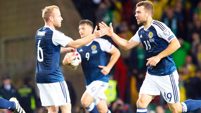 Barry Bannan congratulates James McArthur (19) after his goal earned Scotland a 1-1 draw with Lithuania