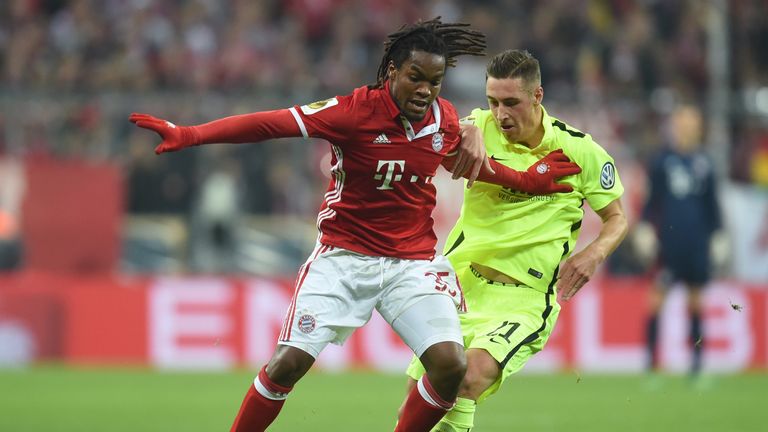 Augsburg's midfielder Dominik Kohr (R) and Bayern Munich's Portuguese midfielder Renato Sanches vie for the ball during the German Cup DFB Pokal second rou