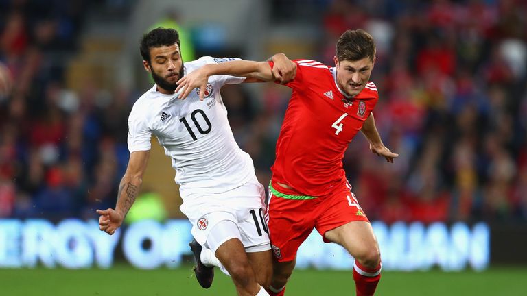 Ben Davies of Wales is closed down by Tornike Okriashvili of Georgia
