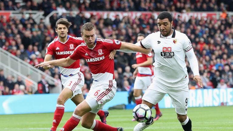 Ben Gibson of Middlesbrough and Troy Deeney of Watford battle for possession during the Premier League clash