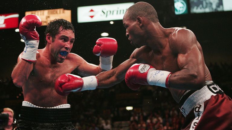 LAS VEGAS - SEPTEMBER 18:  Bernard Hopkins (R) connects with a punch to Oscar De La Hoya during their world middleweight championship at the MGM Grand Gard
