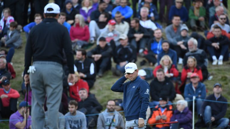 WATFORD, ENGLAND - OCTOBER 16:  Bernd Wiesberger of Austria reacts after missing a birdie putt on the 16th hole during the fourth round of the British Mast