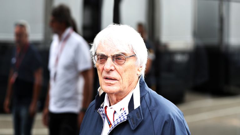Bernie Ecclestone walks through the paddock during practice for German Grand Prix