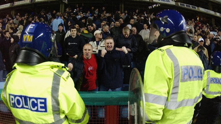 BIRMINGHAM - MARCH 3:  Police officers keep an eye on the fans as tempers reach boiling point on and off the pitch during the FA Barclaycard Premiership ma