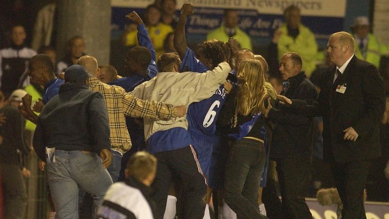 BIRMINGHAM - SEPTEMBER 16:  Clinton Morrison of Birmingham City celebrates scoring their first goal with fans after they run onto the pitch during the Barc