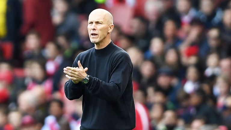 New Swansea boss Bob Bradley encourages his players at Arsenal 