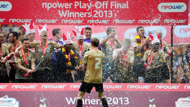 LONDON, ENGLAND - MAY 18:  Bradford City players celebrate promotion during the npower League Two play off final between Bradford City and Northampton Town