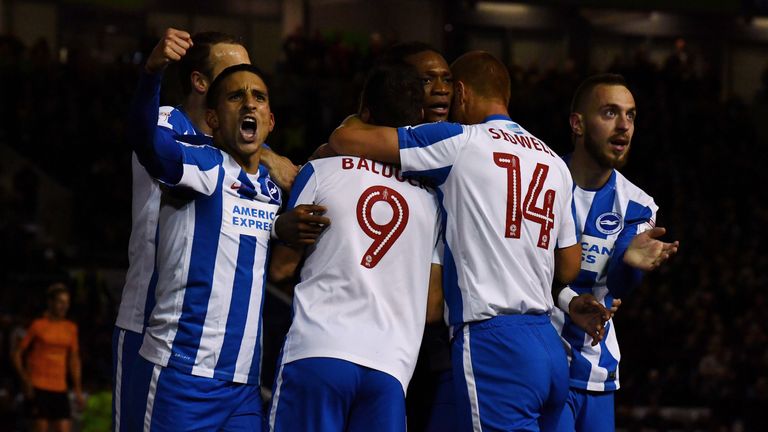 Sam Baldock of Brighton is mobbed after scoring his team's first goal against Wolves