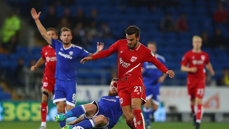 CARDIFF, WALES - OCTOBER 14:  Marlon Pack of Bristol City is fouled by Aron Gunarsson of Cardiff during the Sky Bet Championship match between Cardiff City