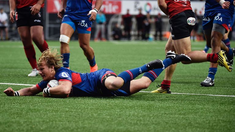 Grenoble's South African scrumhalf Charl Mcleod scores a try during the French Top 14 rugby union match Oyonnax vs Grenoble on April 2, 2016 in Charles-Mat