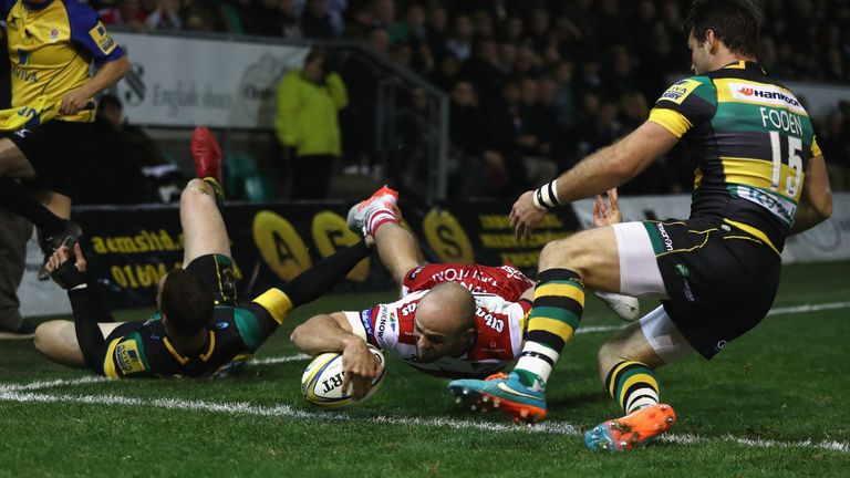 Charlie Sharples of Gloucester dives over for their second try against Northampton