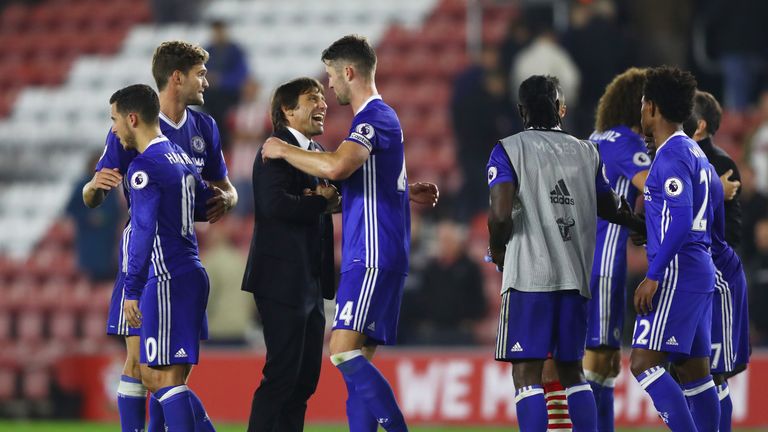 Antonio Conte, Manager of Chelsea (C) and Gary Cahill of Chelsea (CR) embrace after the final whistle during the Premier League match against Southampton