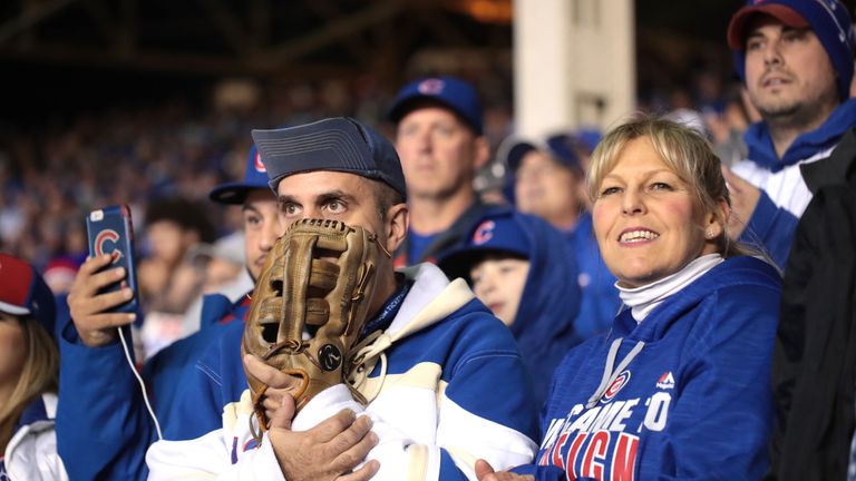 Chicago Cubs fans watch the first World Series game at Wrigley Field for 71 years