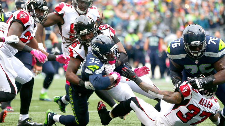 SEATTLE, WA - OCTOBER 16:  Running back Christine Michael #32 of the Seattle Seahawks rushes for a touchdown against the Atlanta Falcons at CenturyLink Fie