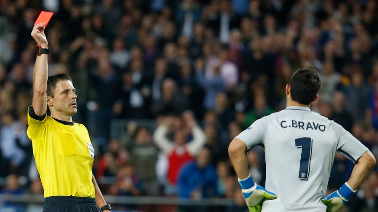 Referee shows a red card to Manchester City's Chilean goalkeeper Claudio Bravo