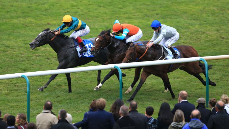 Coronet (left) ridden by Frankie Dettori wins the Godolphin Flying Start Zetland Stakes ahead of Cunco (centre) 