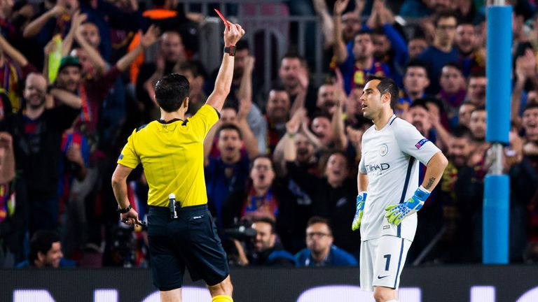 BARCELONA, SPAIN - OCTOBER 19: Claudio Bravo of Manchester City FC is shown a red card during the UEFA Champions League group C match between FC Barcelona 