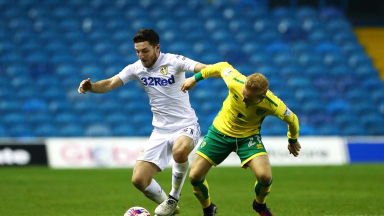 LEEDS, ENGLAND - OCTOBER 25: Lewis Coyle of Leeds United (L) and Alex Pritchard of Norwich City (R) battle for possession during the EFL Cup fourth round m