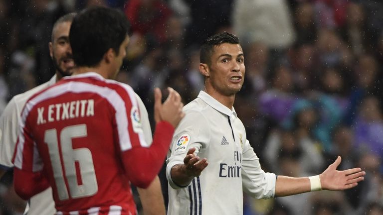 Real Madrid's Portuguese forward Cristiano Ronaldo (R) gestures during the Spanish league football match between Real Madrid CF and Athletic Club Bilbao at