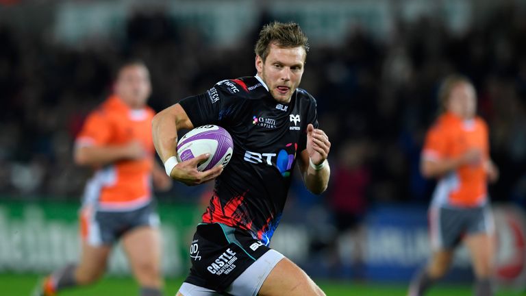 SWANSEA, WALES - OCTOBER 14:  Ospreys fly half Dan Biggar races through for the opening try during the European Rugby Challenge Cup match Ospreys and Newca