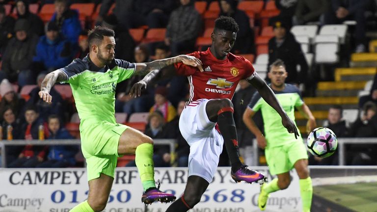 Danny Ings and Axel Tuanzebe in action during the Premier League 2 match between Manchester United and Liverpool