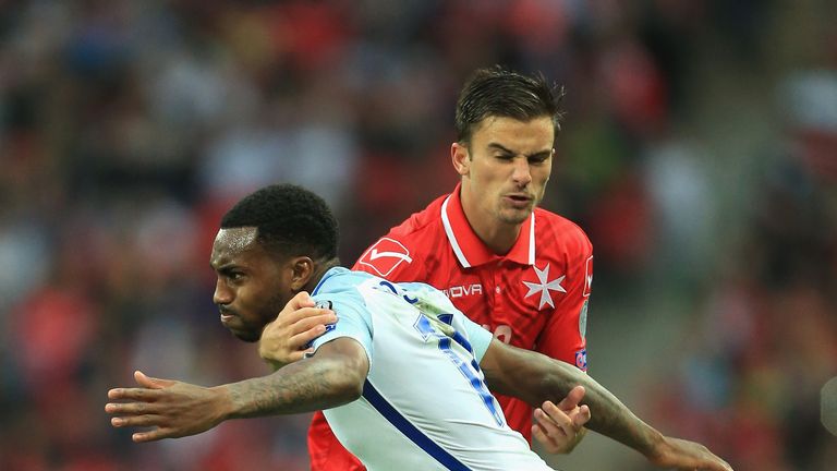 Danny Rose is held back by Bjorn Kristensen 