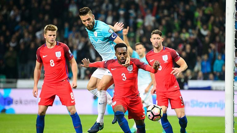 England's defender Danny Rose (2ndR) vies for the ball with Slovenia's defender Bostjan Cesar