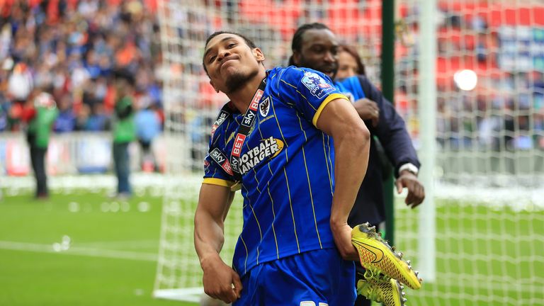 AFC Wimbledon's Darius Charles celebrates after the match