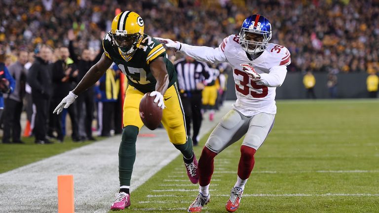 GREEN BAY, WI - OCTOBER 09:  Davante Adams #17 of the Green Bay Packers scores a touchdown in front of Michael Hunter #39 of the New York Giants during the