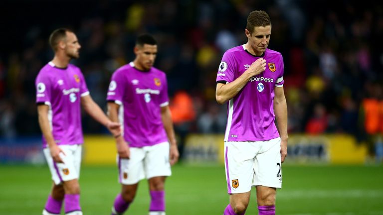 Michael Dawson of Hull City (R) is dejected after the final whistle during the Premier League match between Watford and Hull