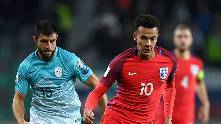 LJUBLJANA, SLOVENIA - OCTOBER 11:  Dele Alli of England runs with the ball under pressure from Bojan Jokic of Slovenia during the FIFA 2018 World Cup Quali