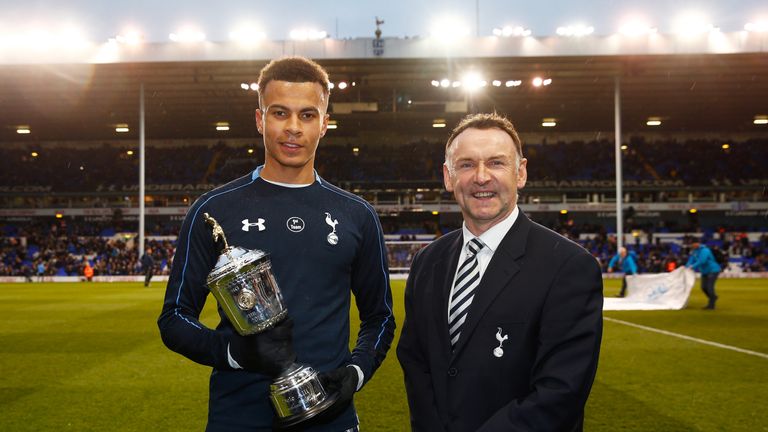 LONDON, ENGLAND - APRIL 25:  PFA Young Player of The Year Dele Alli pose with the trophy alongside Paul Allen prior to kickoff during the Barclays Premier 