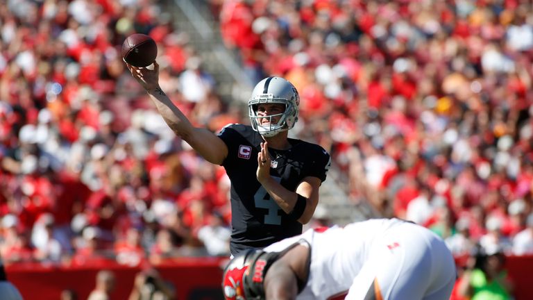 TAMPA, FL - OCTOBER 30:  Quarterback Derek Carr #4 of the Oakland Raiders throws to an open receiver during the first quarter of an NFL game against the Ta