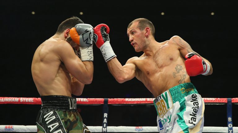Derry Mathews throws a right punch at Tony Luis during the vacant WBA Interim World Lightweight title fight.