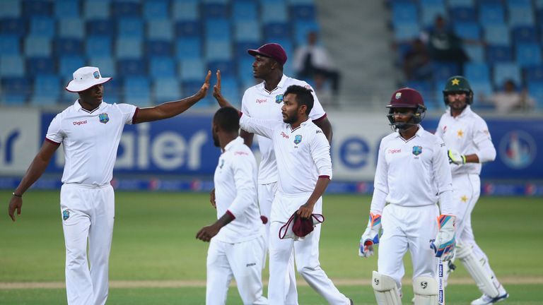 Devendra Bishoo (centre) was the star of day four in Dubai