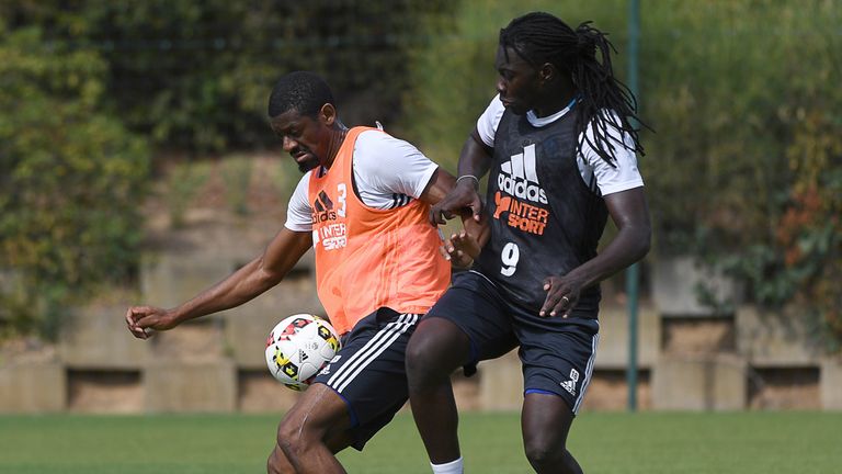 Olympique de Marseille's football players Abou Diaby and Bafetimbi Gomis (R) take part in a training session on August 9, 2016 at the Robert Louis-Dreyfus 