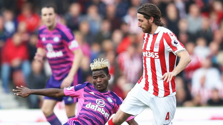 Stoke's Joe Allen evades a sliding challenge from Dider Ndong of Sunderland