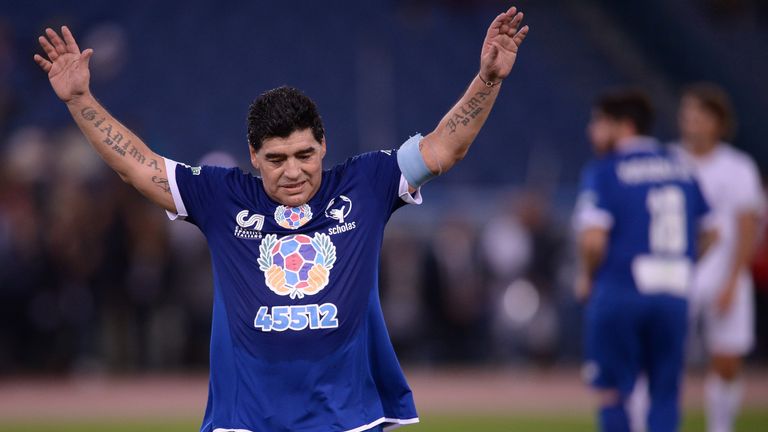 Diego Maradona salutes the crowd at the Match for Peace