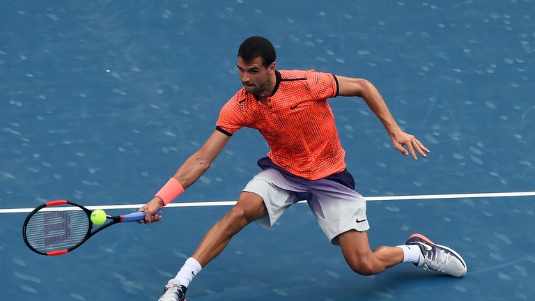 Grigor Dimitrov of Bulgaria hits a return against Albert Ramos-Vinolas of Spain during their men's singles semi-final match at Chengdu Open ATP tennis tour