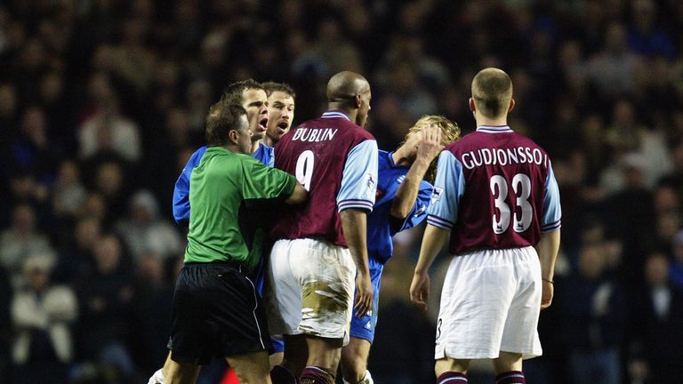 BIRMINGHAM - MARCH 3:  Dion Dublin of Aston Villa loses his cool as he head butts Robbie Savage of Birmingham City during the FA Barclaycard Premiership ma