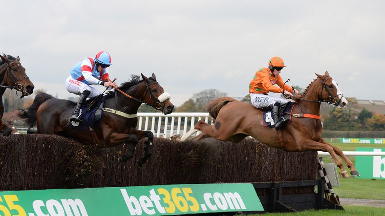 Double W's and Brian Hughes (right) leads Fou Et Sage over the final fence to win the racinguk.com Steeple Chase at Wetherby.