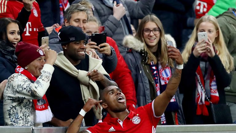 Douglas Costa (L) celebrates a goal for Bayern Munich v Borrusia Monchengladbach