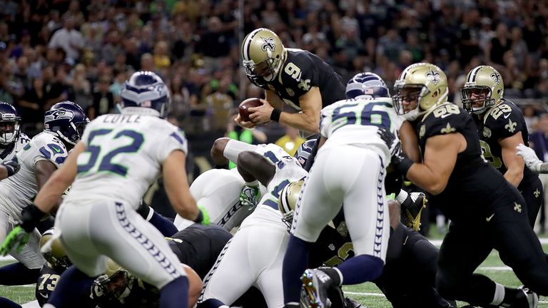 NEW ORLEANS, LA - OCTOBER 30:  Drew Brees #9 of the New Orleans Saints dives into the endzone for a touchown against the Seattle Seahawks during the second