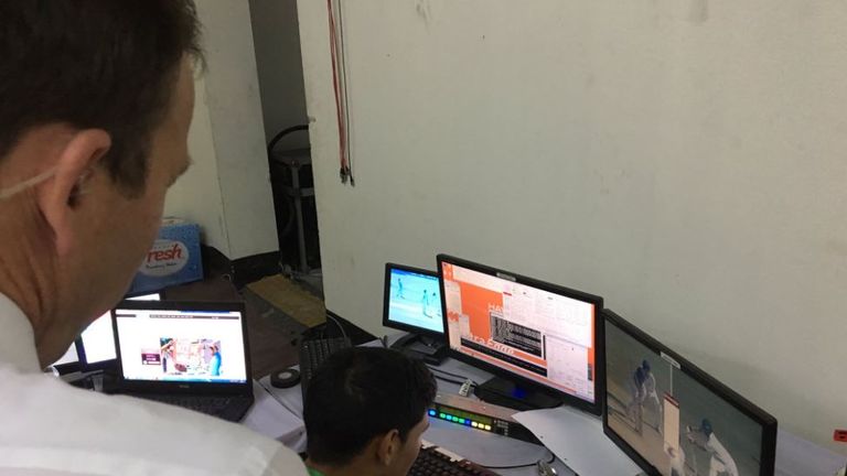 Mike Atherton watches the Hawkeye technicians in action