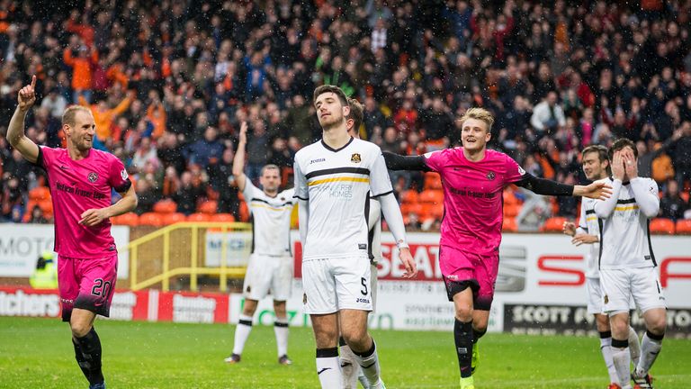 Dundee United celebrate after Dumbarton's Gregor Buchanan heads the ball into his own net
