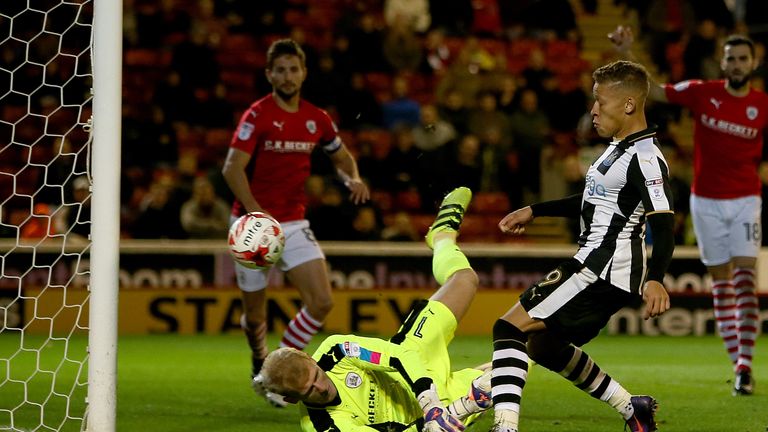 Newcastle United's Dwight Gayle scores his opening goal during the Sky Bet Championship match at Oakwell, Barnsley.