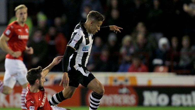 Barnsley's Conor Hourihane (left) tackles Newcastle United's Dwight Gayle