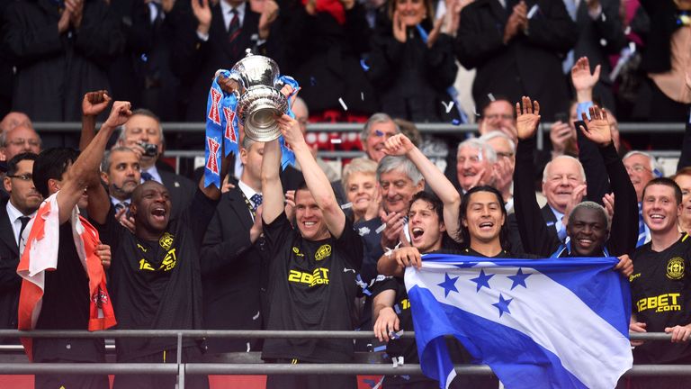 Emmerson Boyce and Gary Caldwell lift the FA Cup in 2013