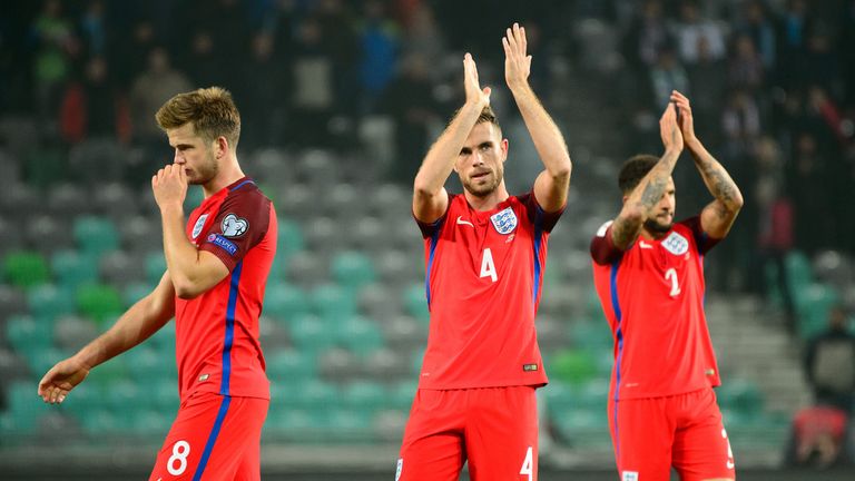 (L-R) Eric Dier, Jordan Henderson and Kyle Walker applaud fans after the final whistle