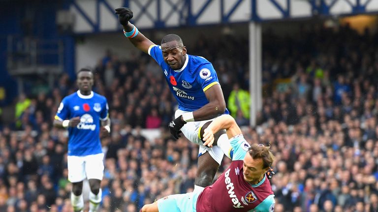 Yannick Bolasie of Everton (L) has his shot blocked by West Ham's Mark Noble 